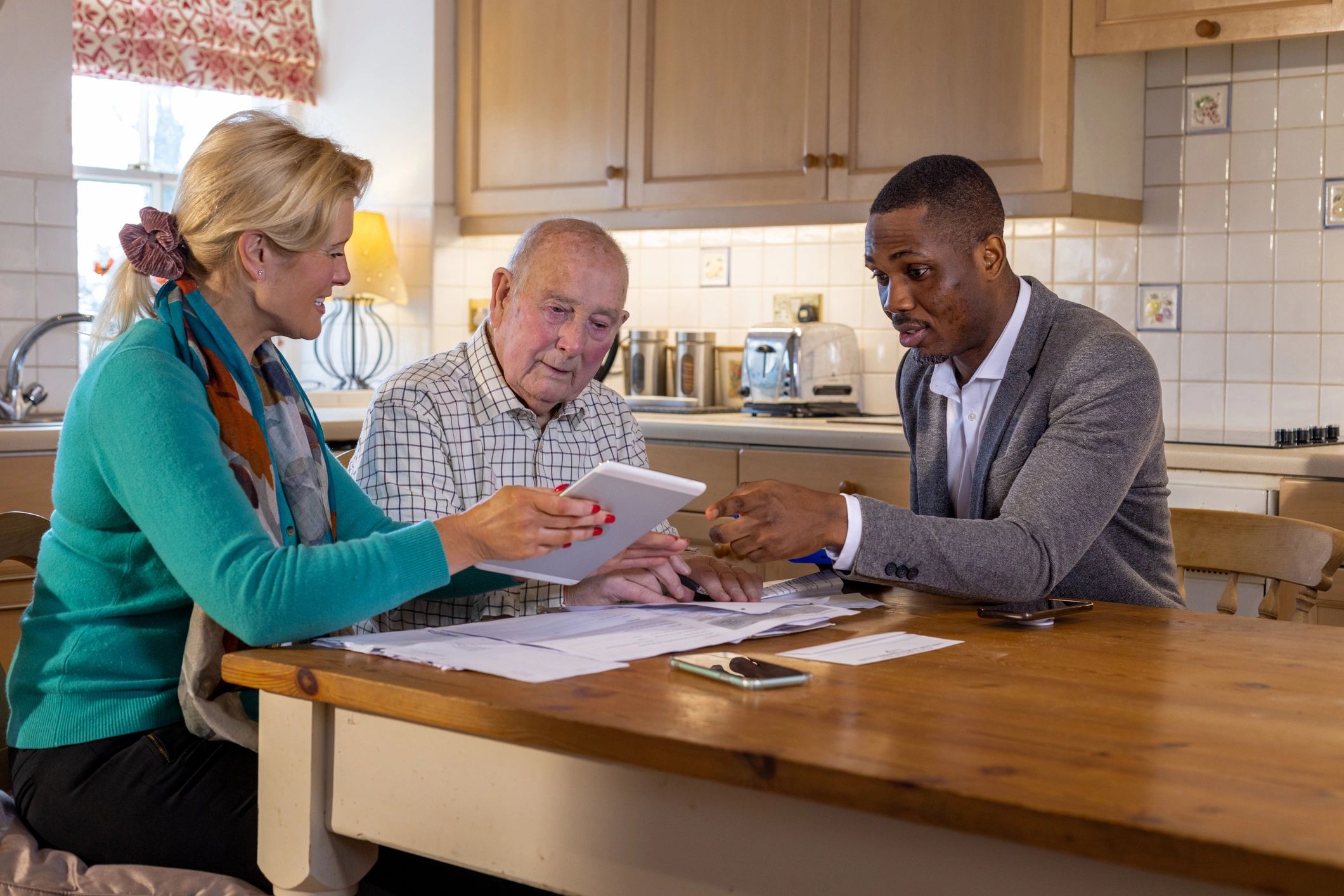Advisor reviewing financial documents with clients for tax planning